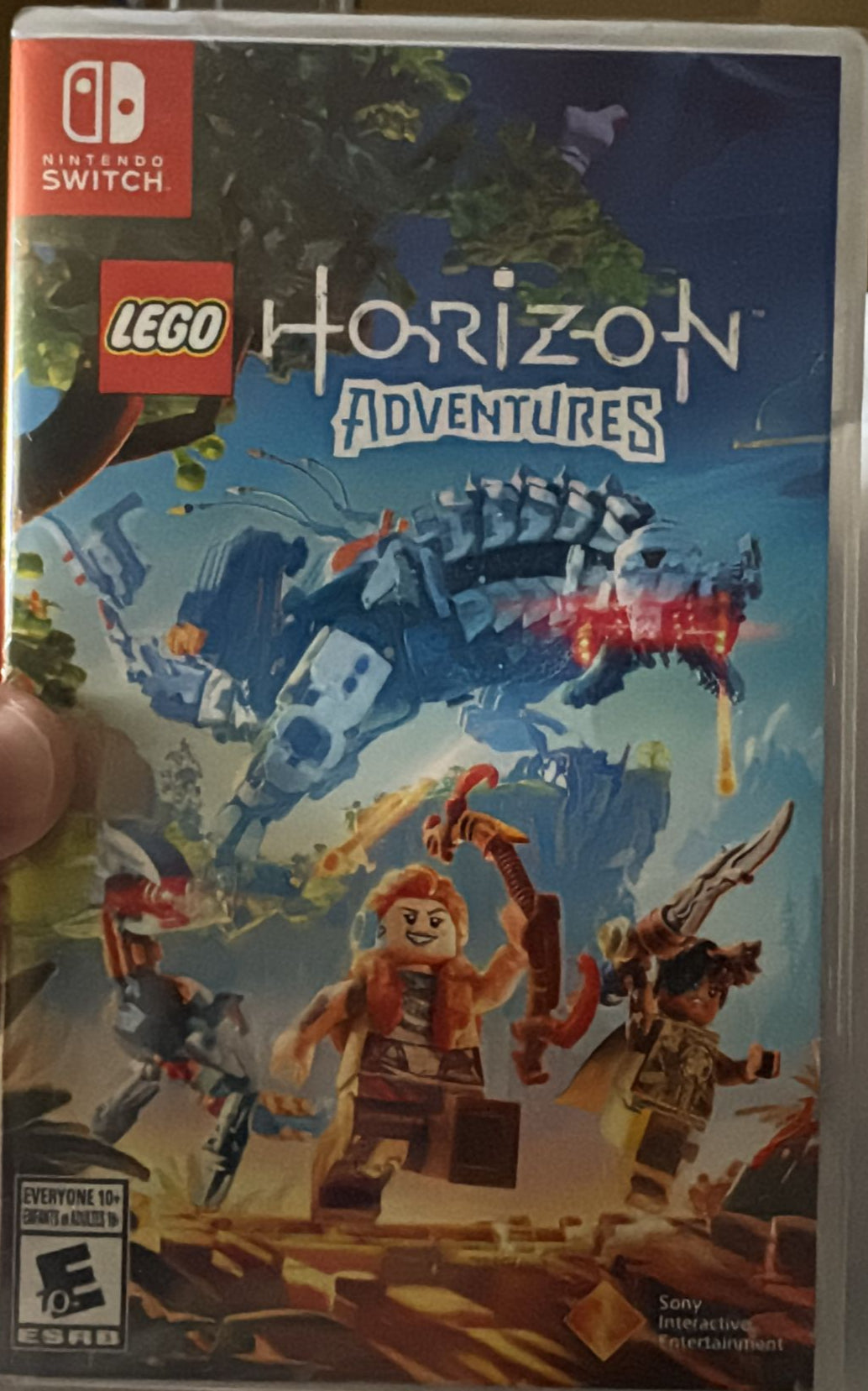 LEGO Horizon Adventures game case held by a hand